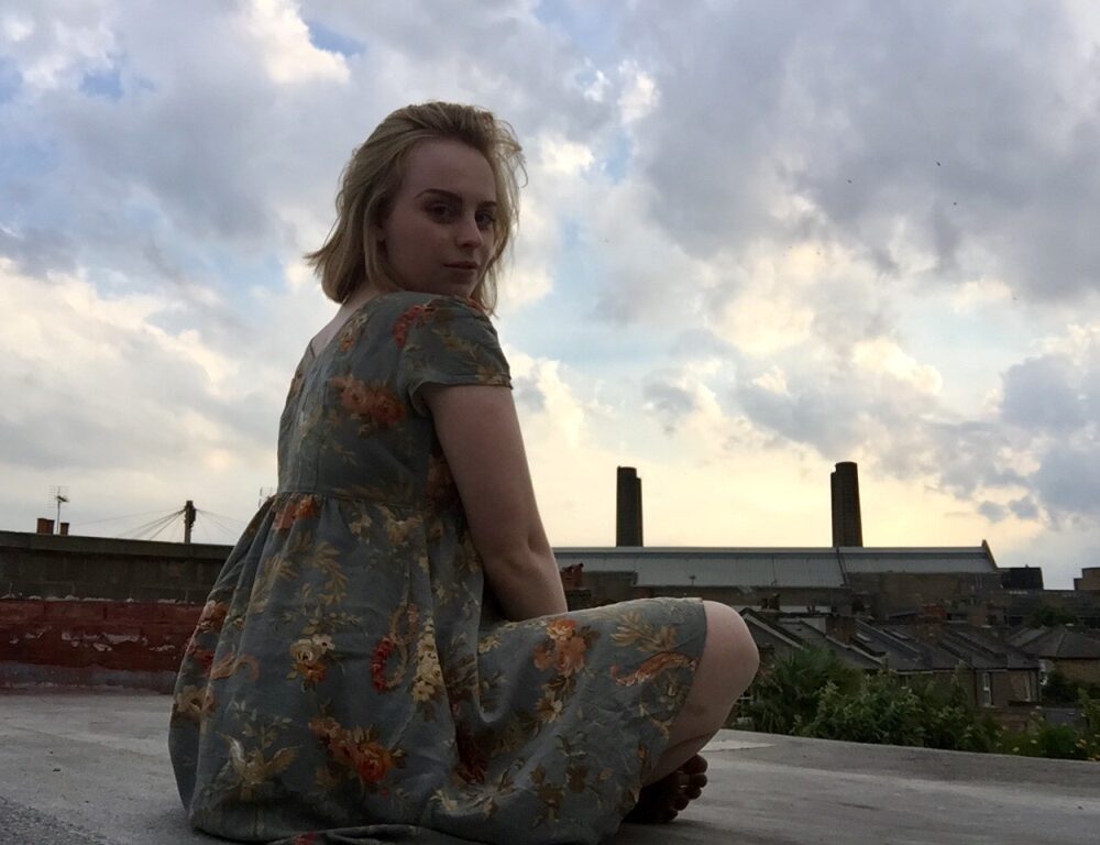 Charlotte Atkinson on the rooftop of her flatshare in Greenwich, London