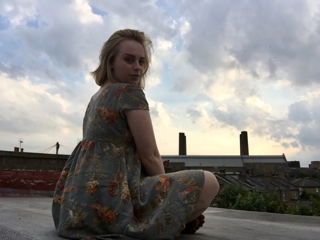 Charlotte Atkinson on the rooftop of her flatshare in Greenwich, London
